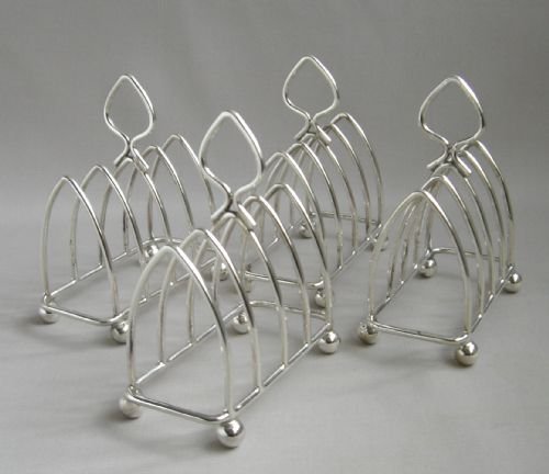 set of four silver toast racks