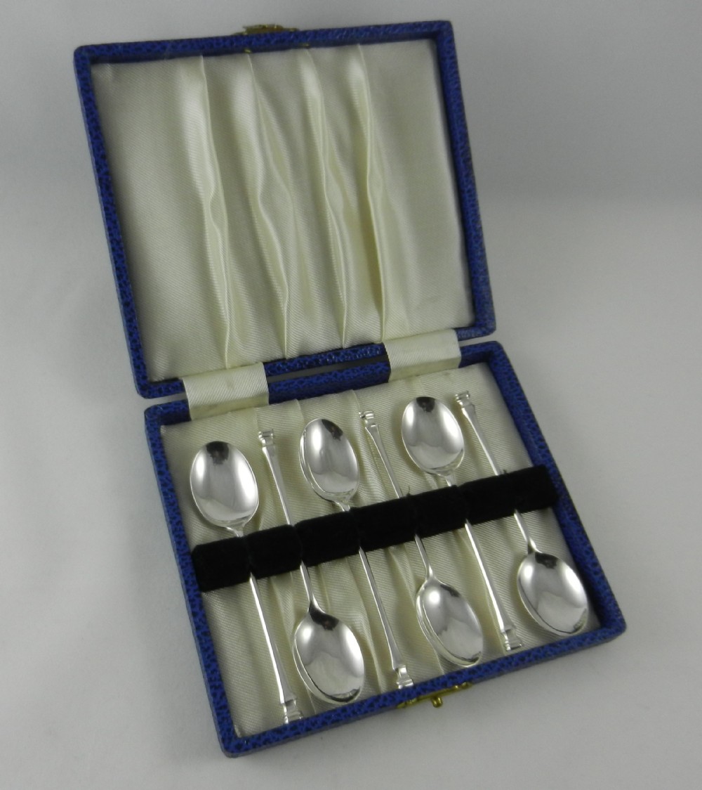 seal top silver spoons