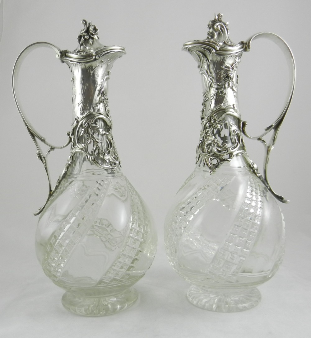 pair antique silver mounted claret jugs