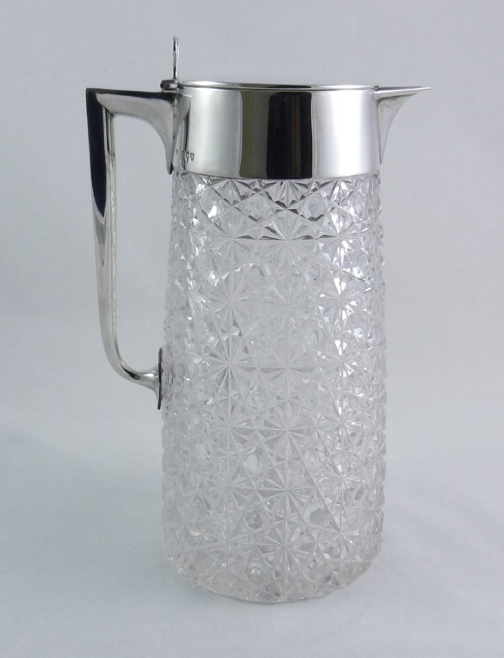 antique silvermounted cutglass wine jug