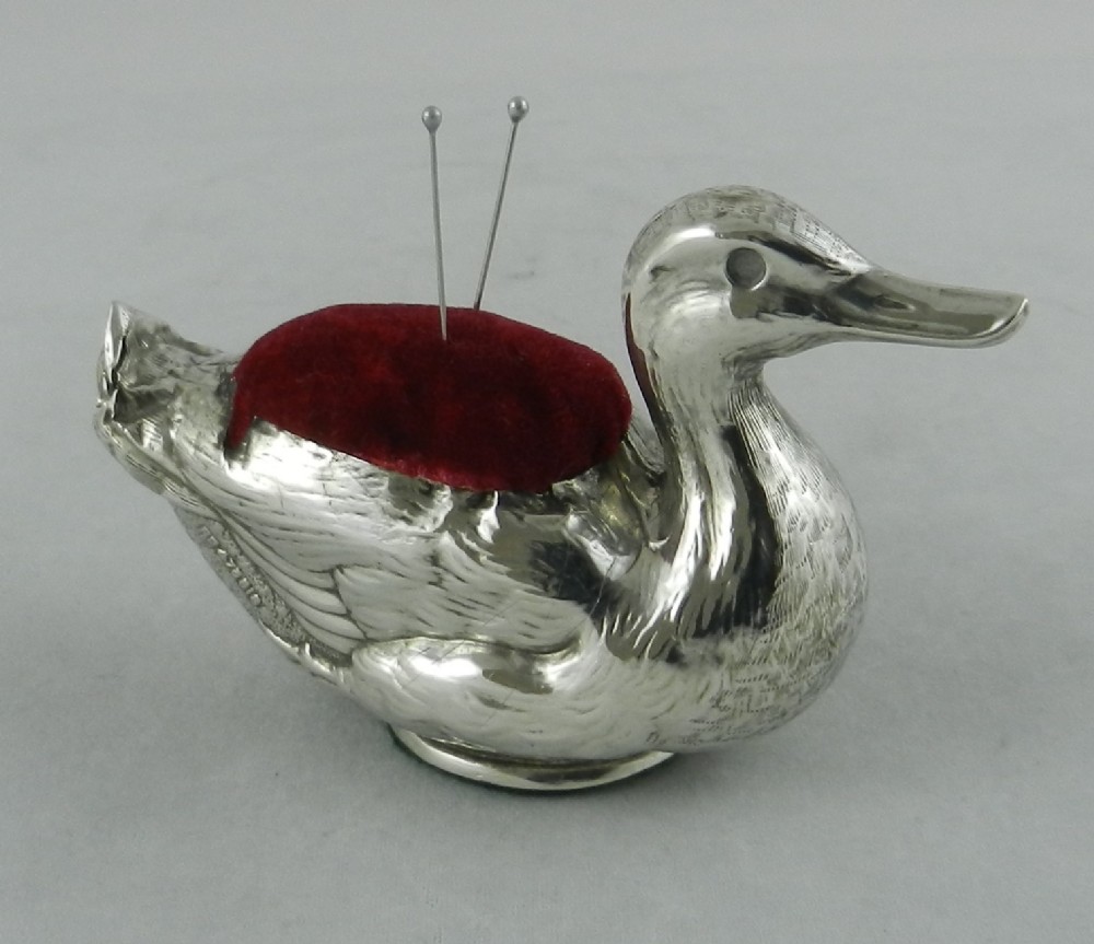 antique silver duck pin cushion