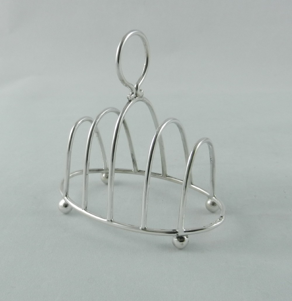 dainty antique silver toast rack