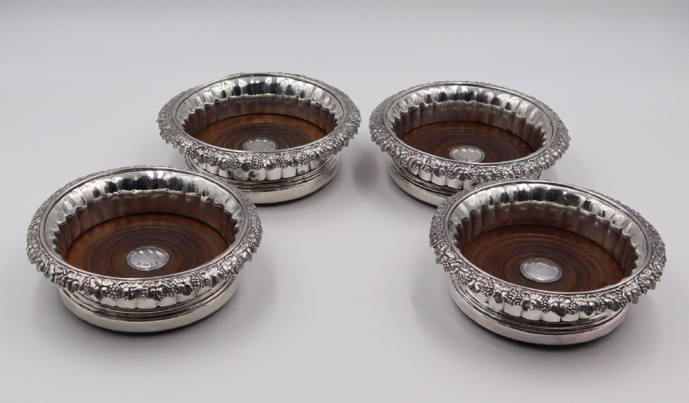 set of four silver wine coasters