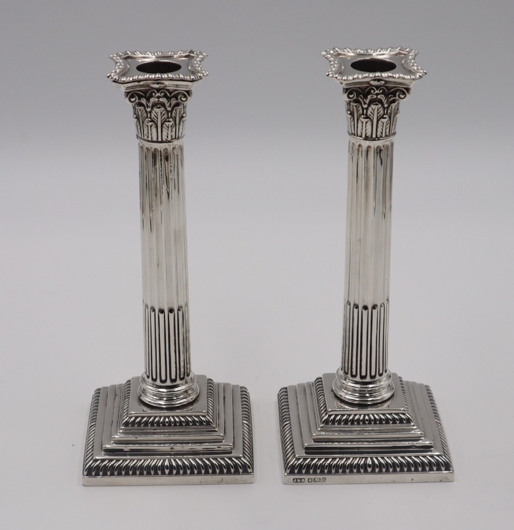 pair of antique silver candlesticks