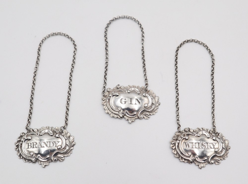 set of antique silver decanter labels