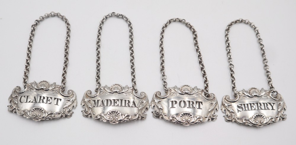 set of antique silver decanter labels