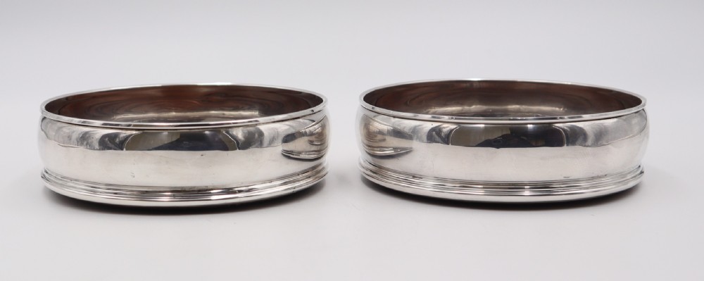 pair of silver coasters