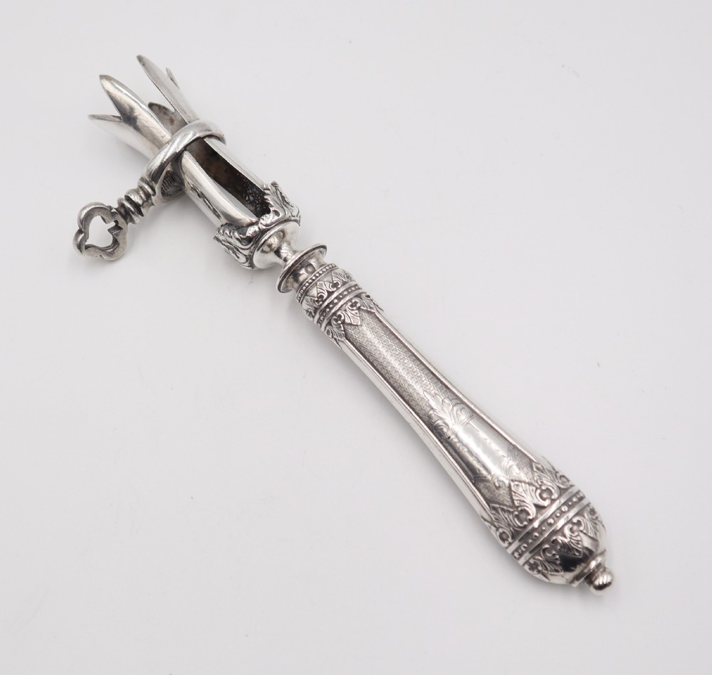 antique silver ham bone holder