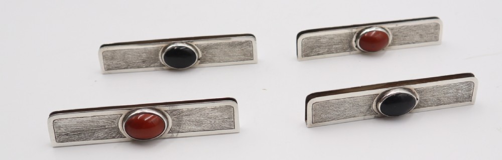 set of silver menu holders